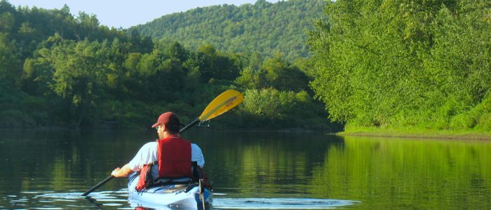 Brice Paddling with blue sky